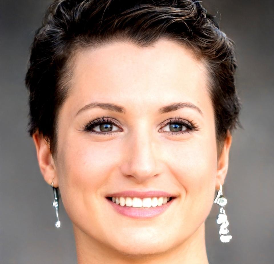 Professional headshot of Svetlana Kowalski, Senior Market Analyst