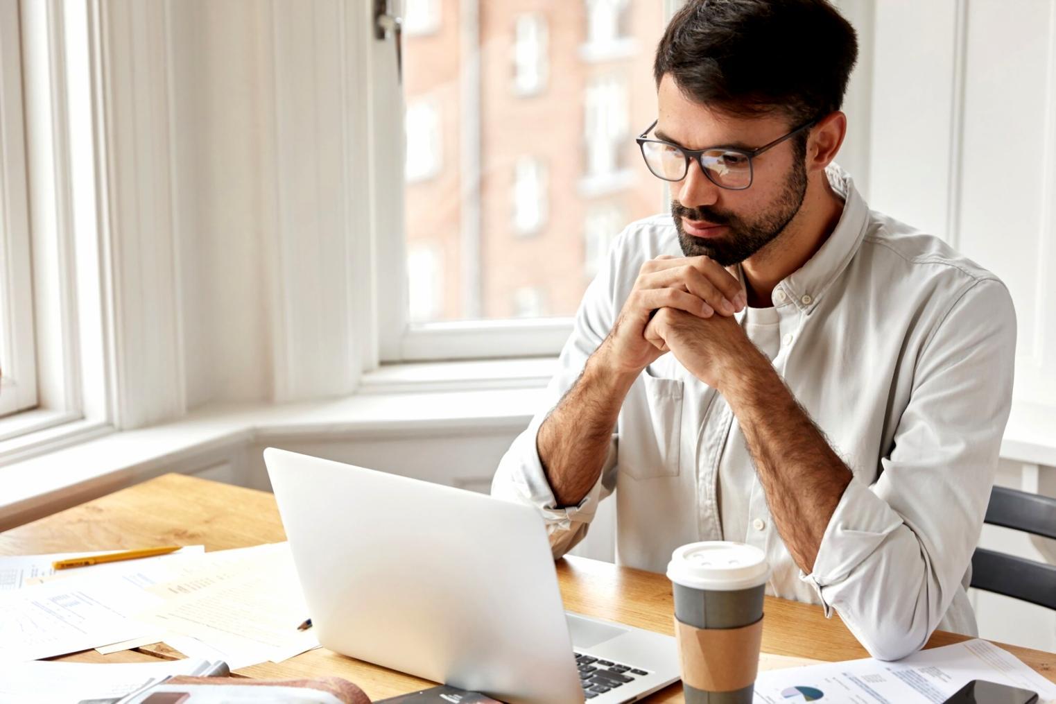 Students analyzing stock charts and market data during a practical learning session